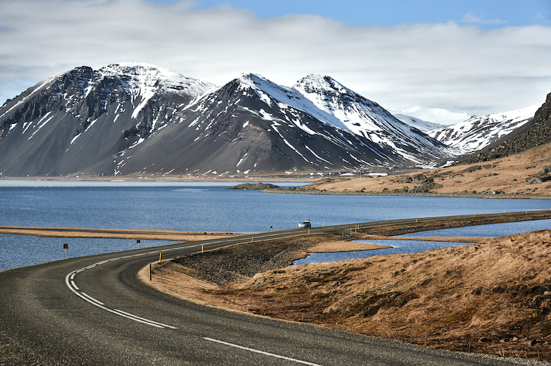 Scenic mountain road by a lake