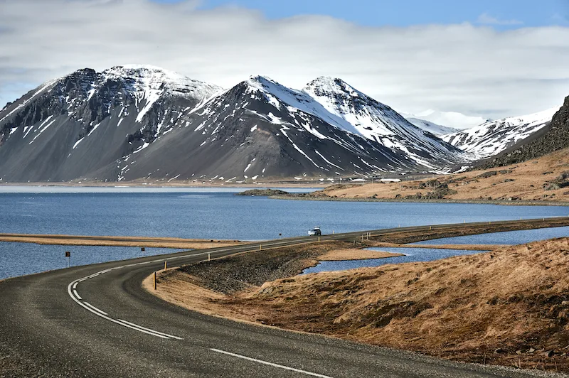 Scenic mountain road by a lake